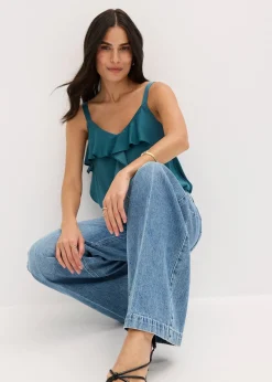 Jean large taille mi-haute, longueur sol, peu extensible