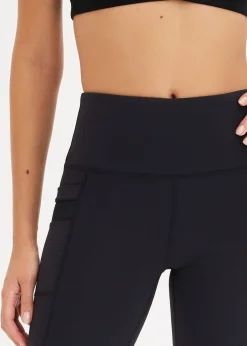 Legging de sport confortable avec mesh et poche pour portable