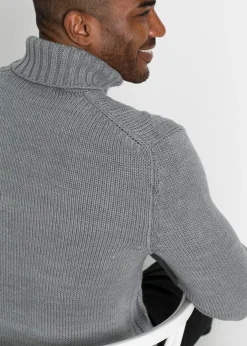 Pull col roulé en maille torsadée