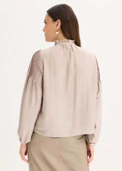Tunique en satin brillant avec plis religieuse